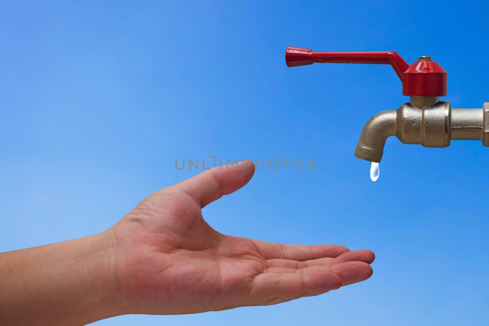 Save water concept, world water day, hand and tap on blue background