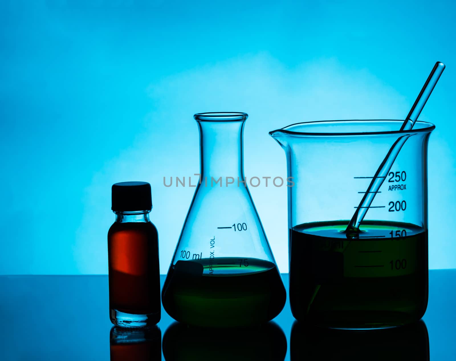 Science flask and test tube on blue background