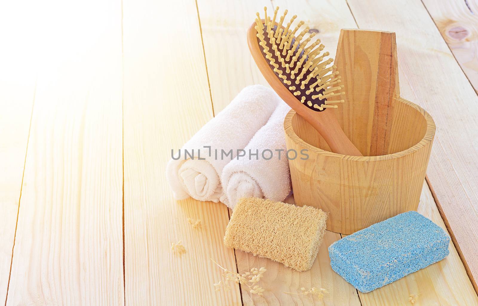 Spa equipment set on wood table and sunlight, treatment concept