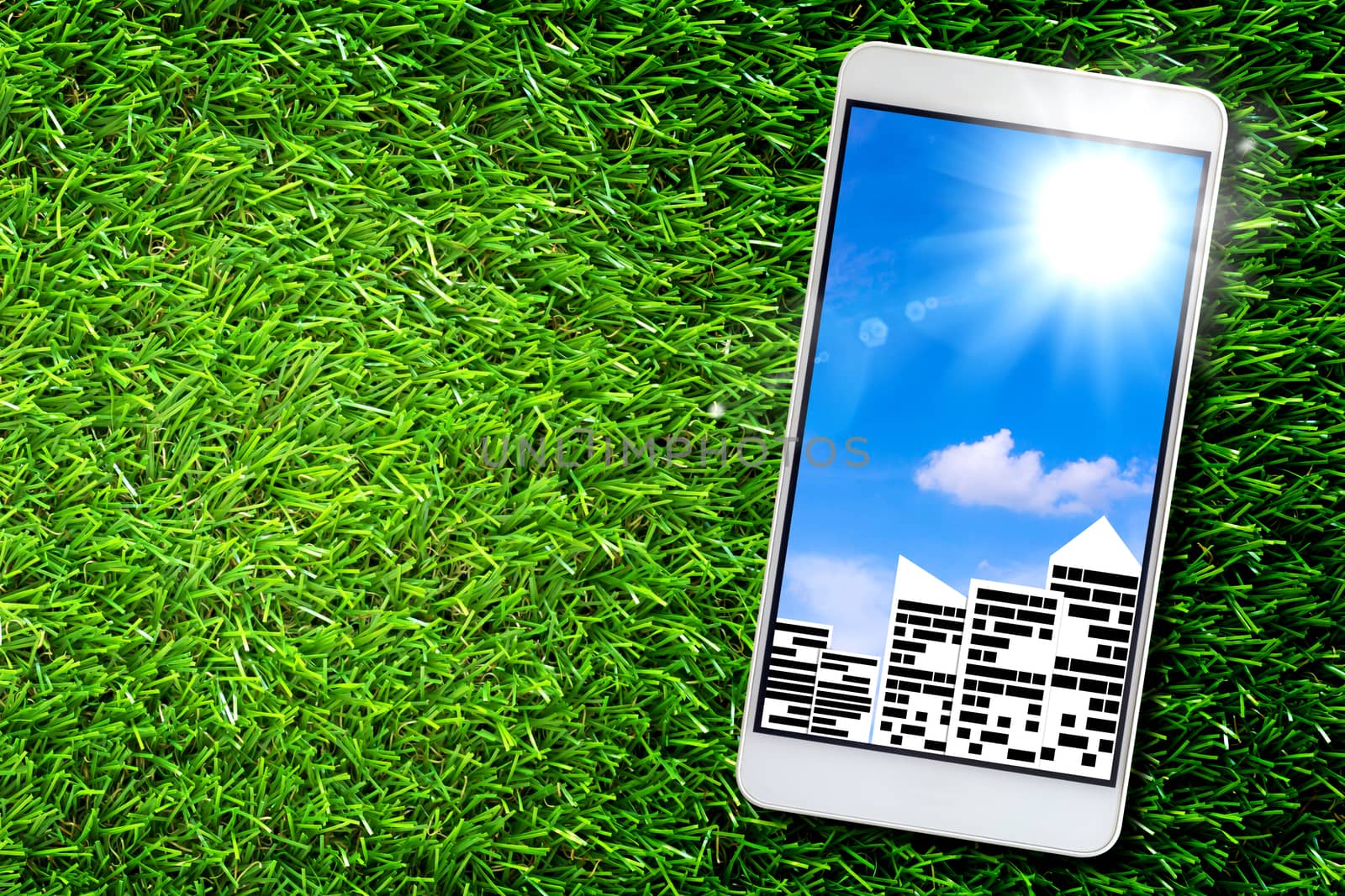 Smart city concept, group of building on green grass background, mobile phone, ecology and nature friendly