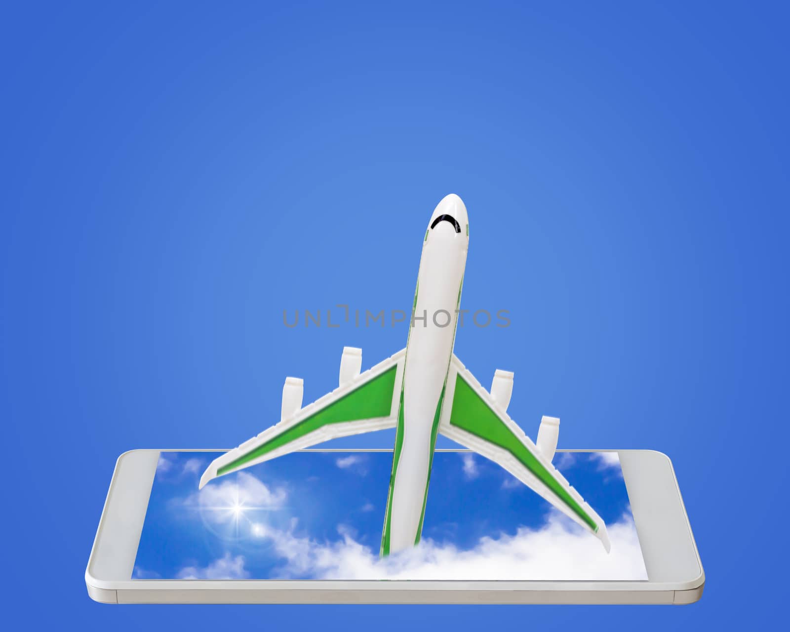Travel concept, online booking, airplane and mobile phone on blue background