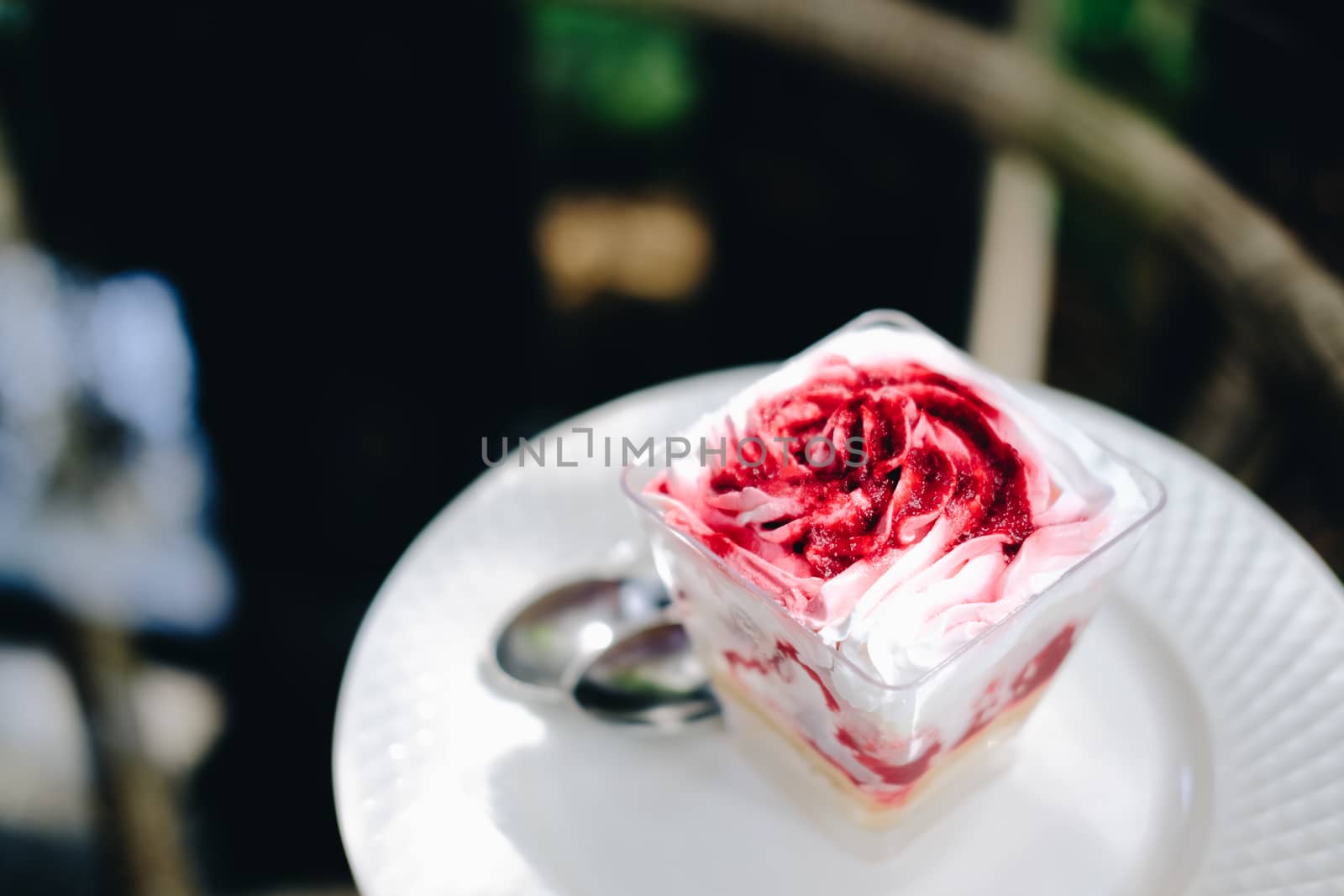 strawberry cream cheesecake in plastic cup. homemade dessert