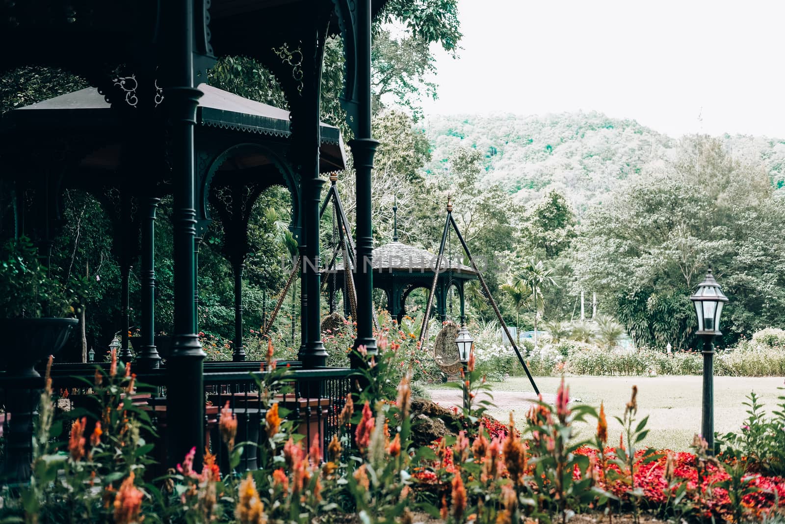 gazebo pavilion for resting in garden park. tranquil nature scene