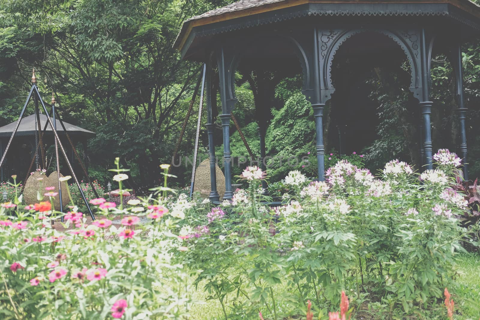 gazebo pavilion for resting in garden park. tranquil nature scene
