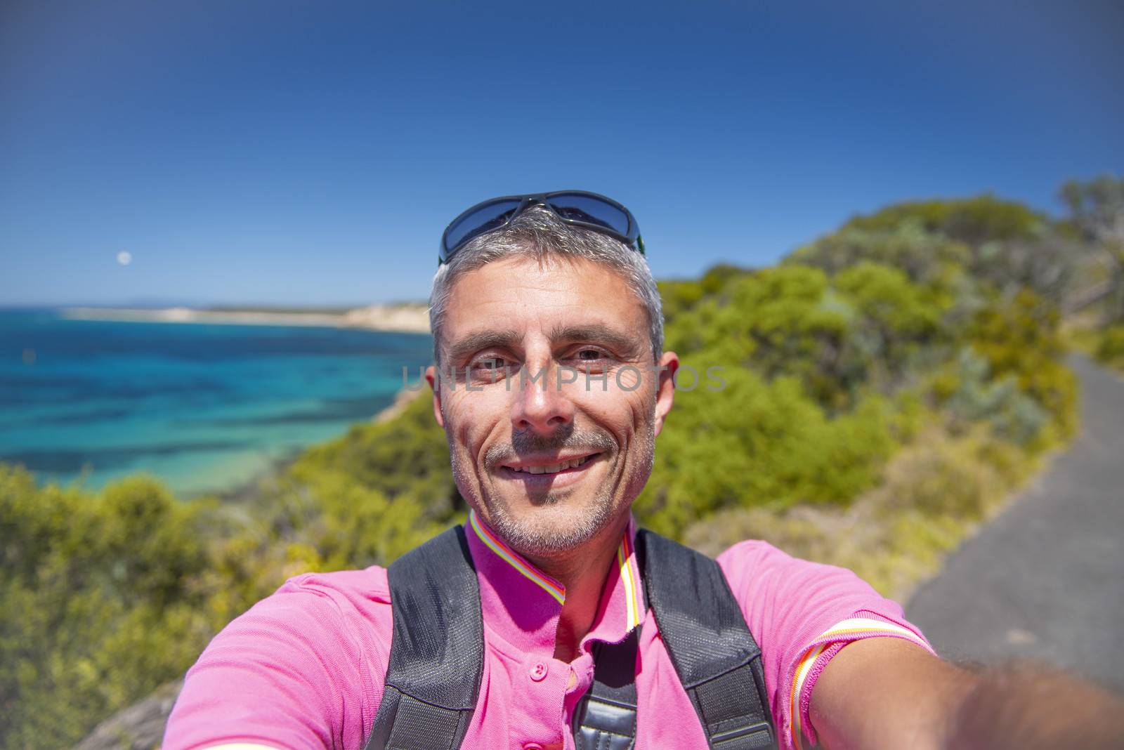 Male tourist taking a selfie on the Australian Coast.