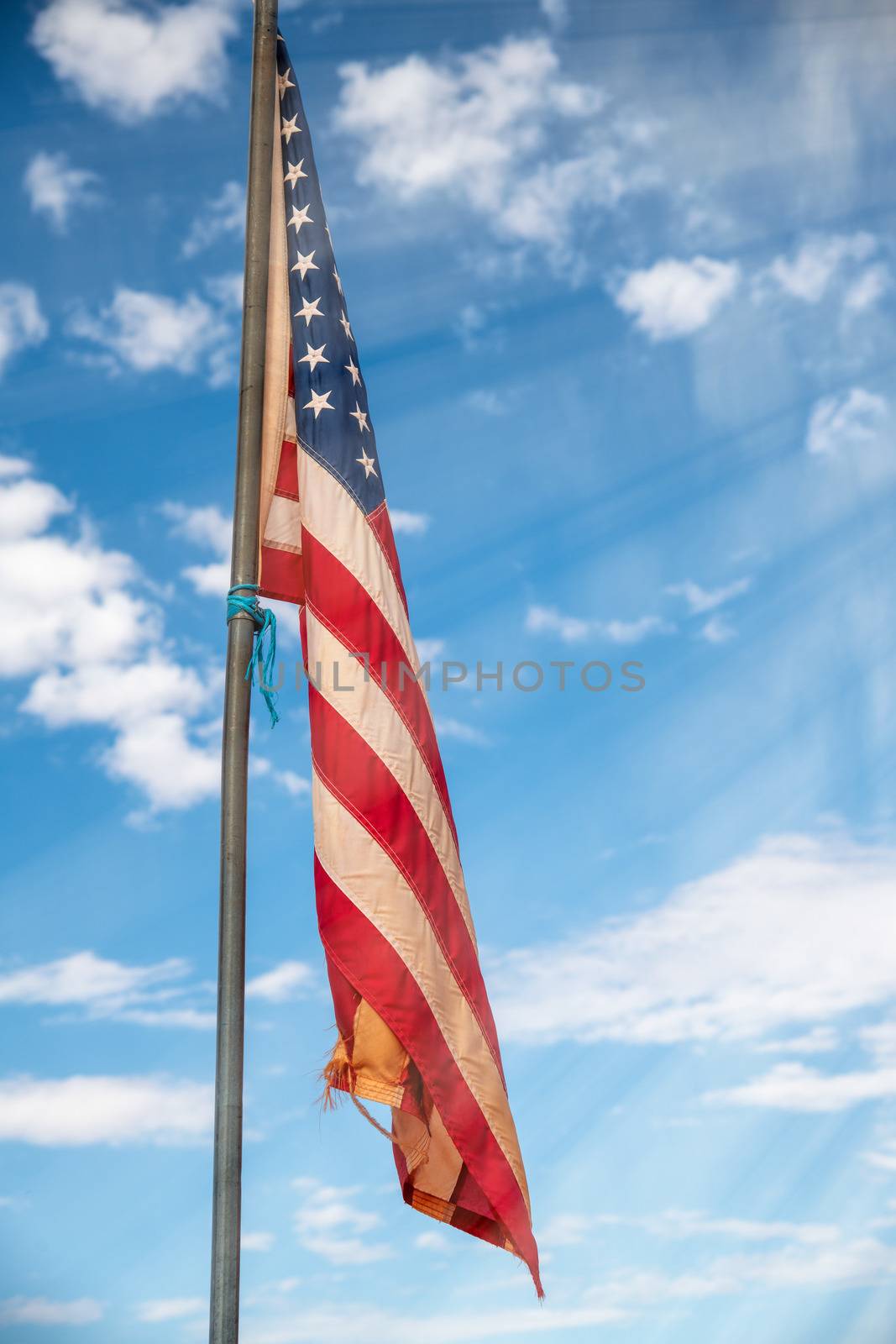 American flag against blue sky landscape, USA by jovannig