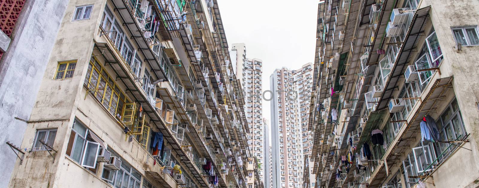 Run Down Living Quarters in Hong Kong. Crowded Residential Apart by jovannig