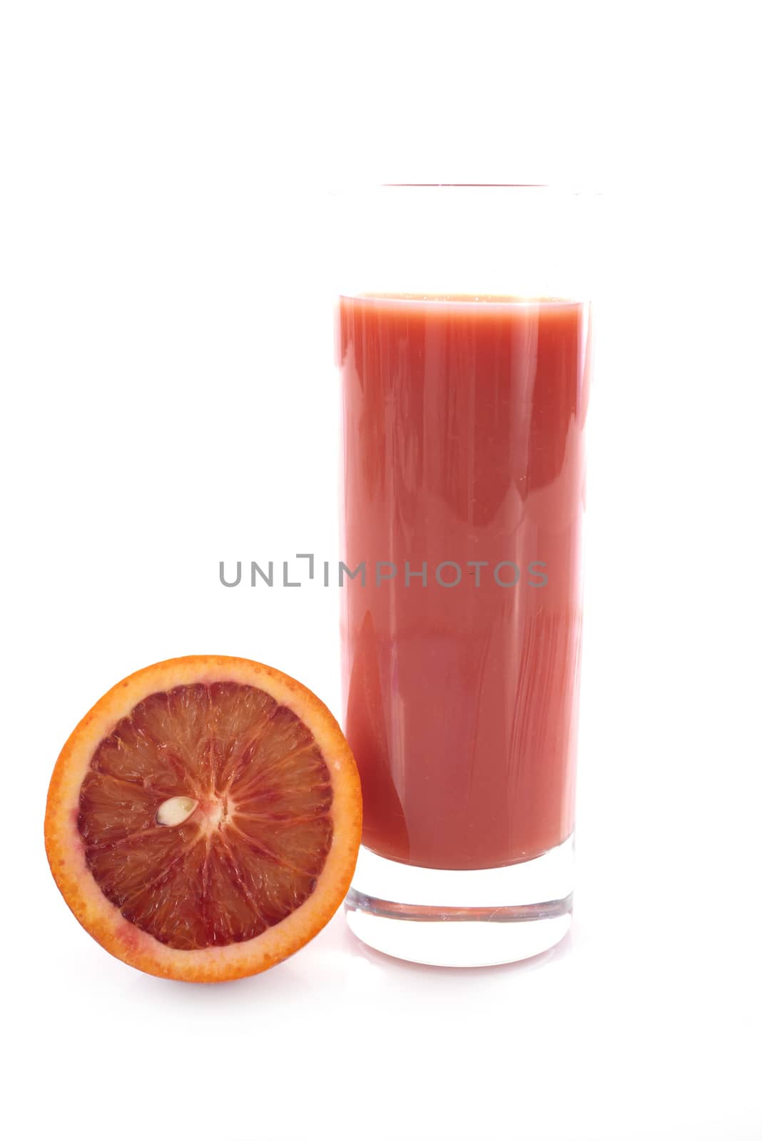 blood orange juice in front of white background