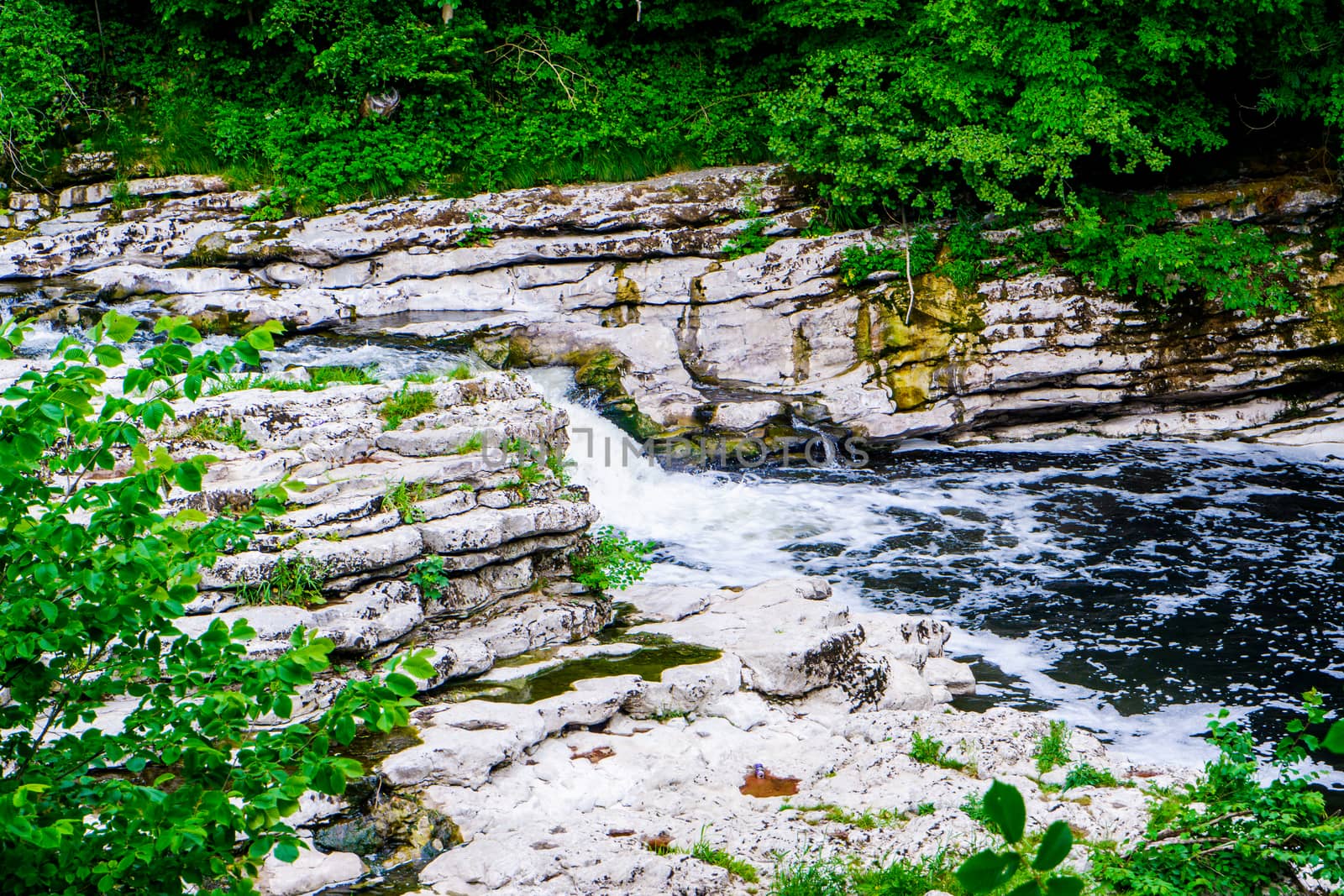 small waterfall in river Kent at force falls Sedwick UK