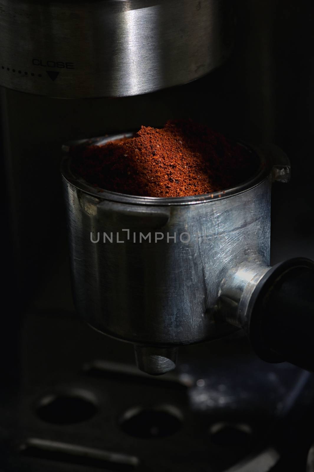 Coffee In Professional Grade Portafilter Making Espresso  by mady70