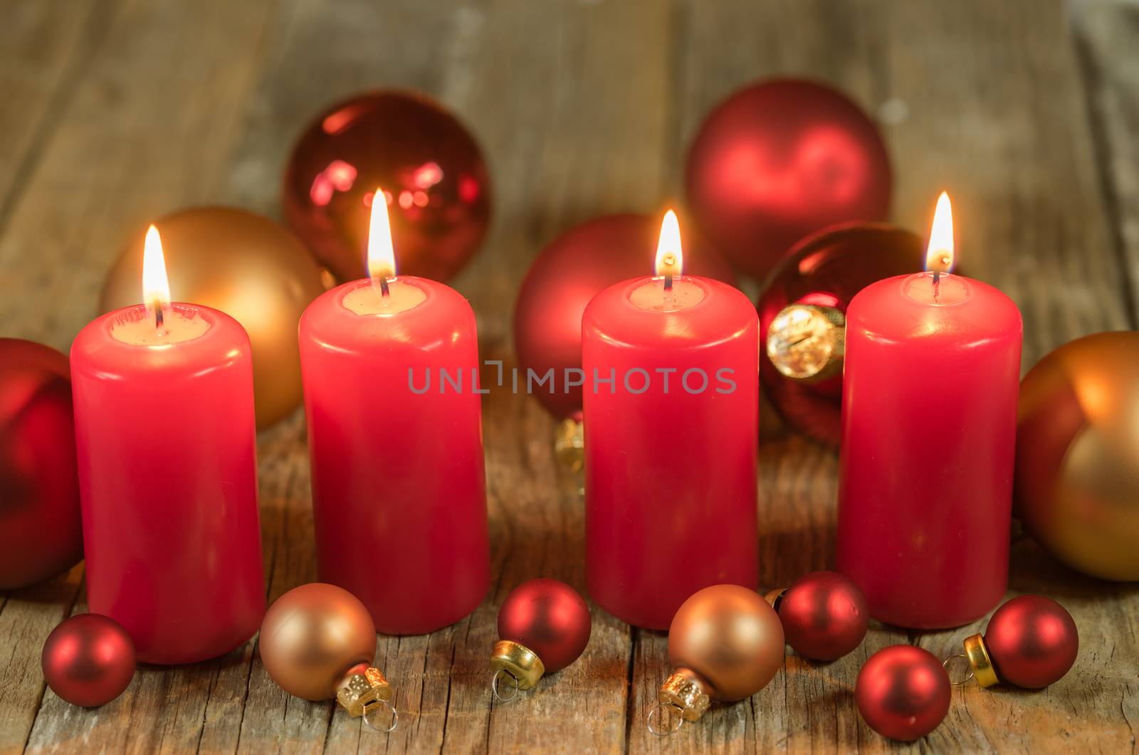 Christmas or advent red candles with balls ornaments decoration