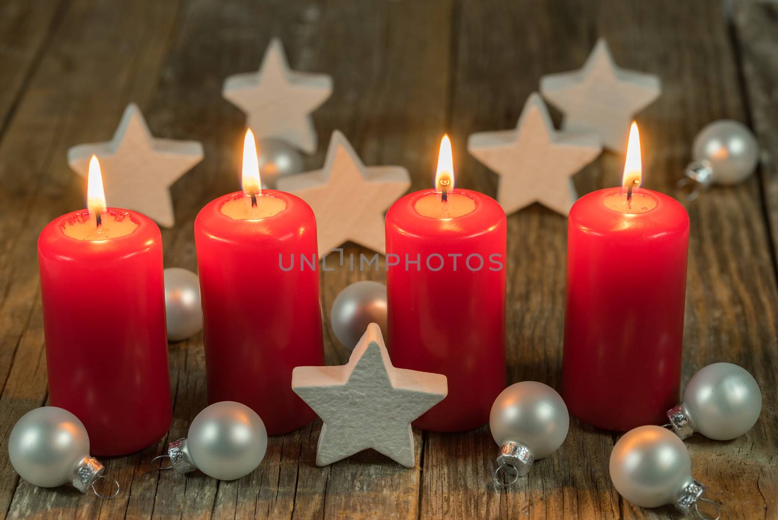 Christmas or advent red candles with stars and balls decoration