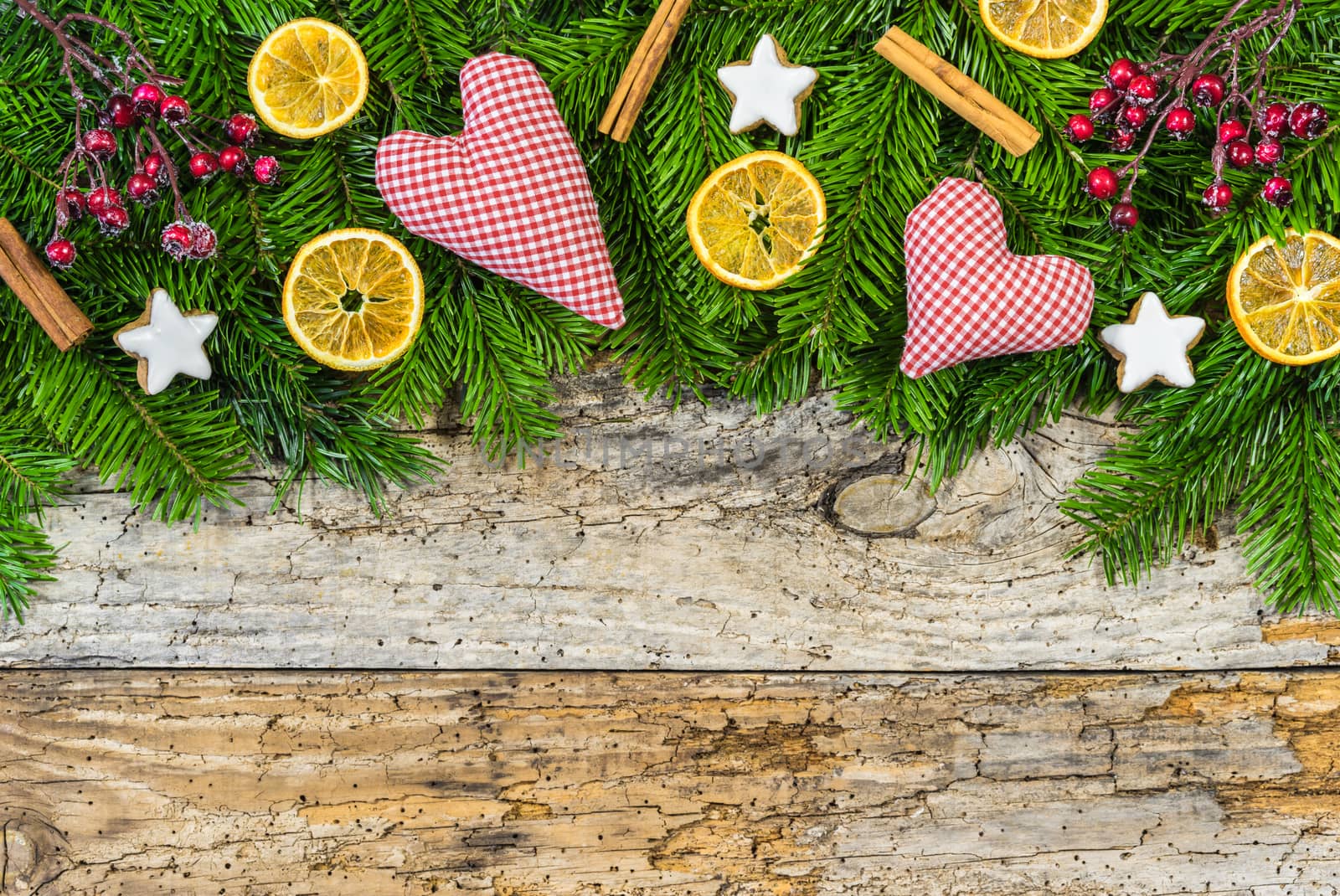 Xmas decoration with hearts and natural elements on wooden background with copy space