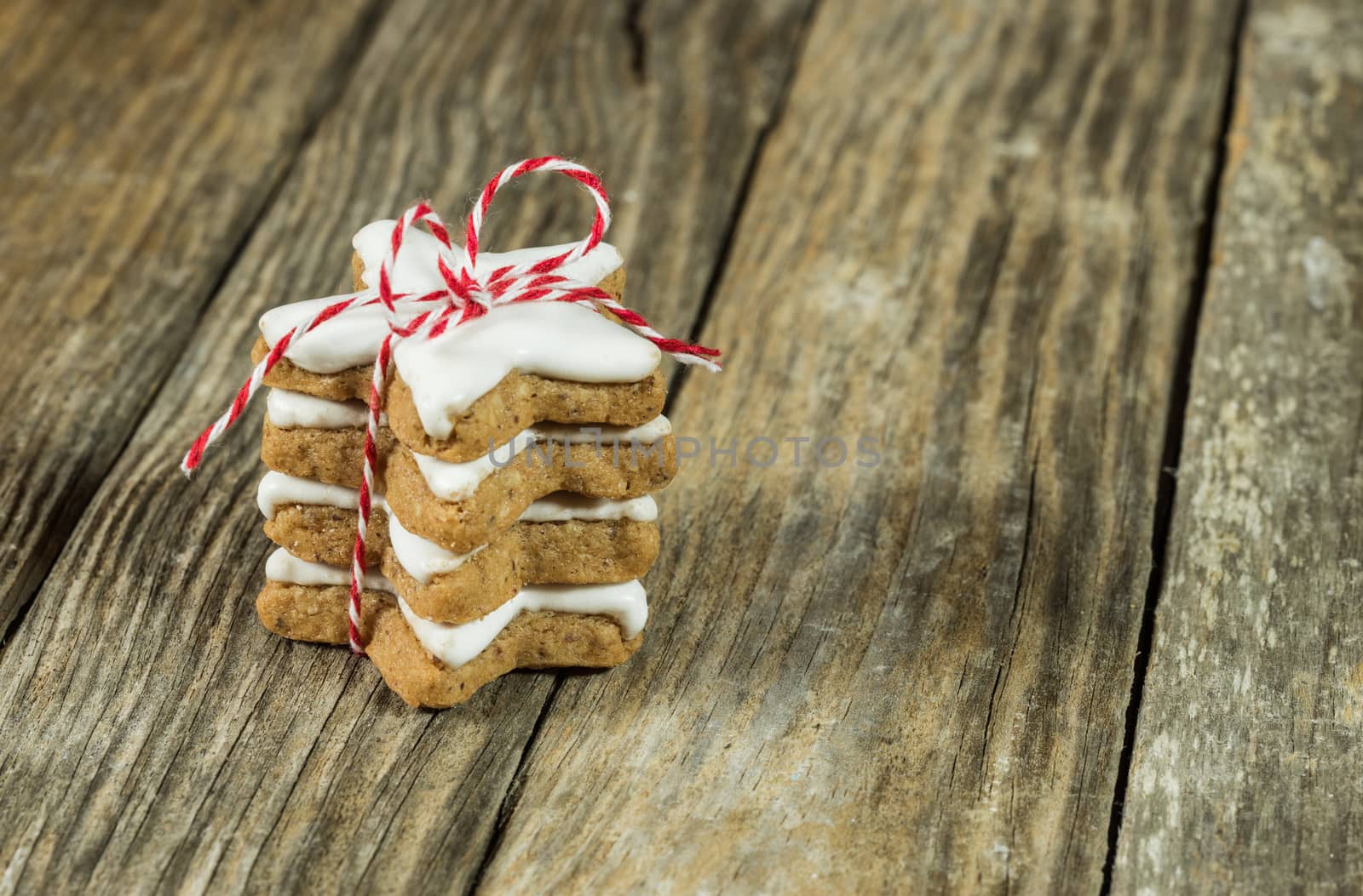 Christmas gift stacked biscuits on wooden table background with copy space