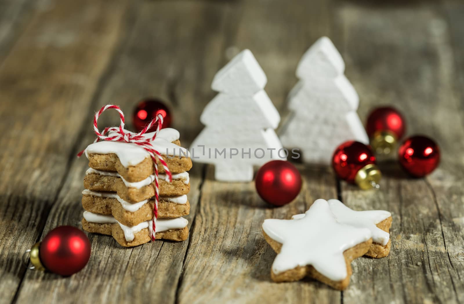 Composition with star shape biscuits and red white christmas decorations