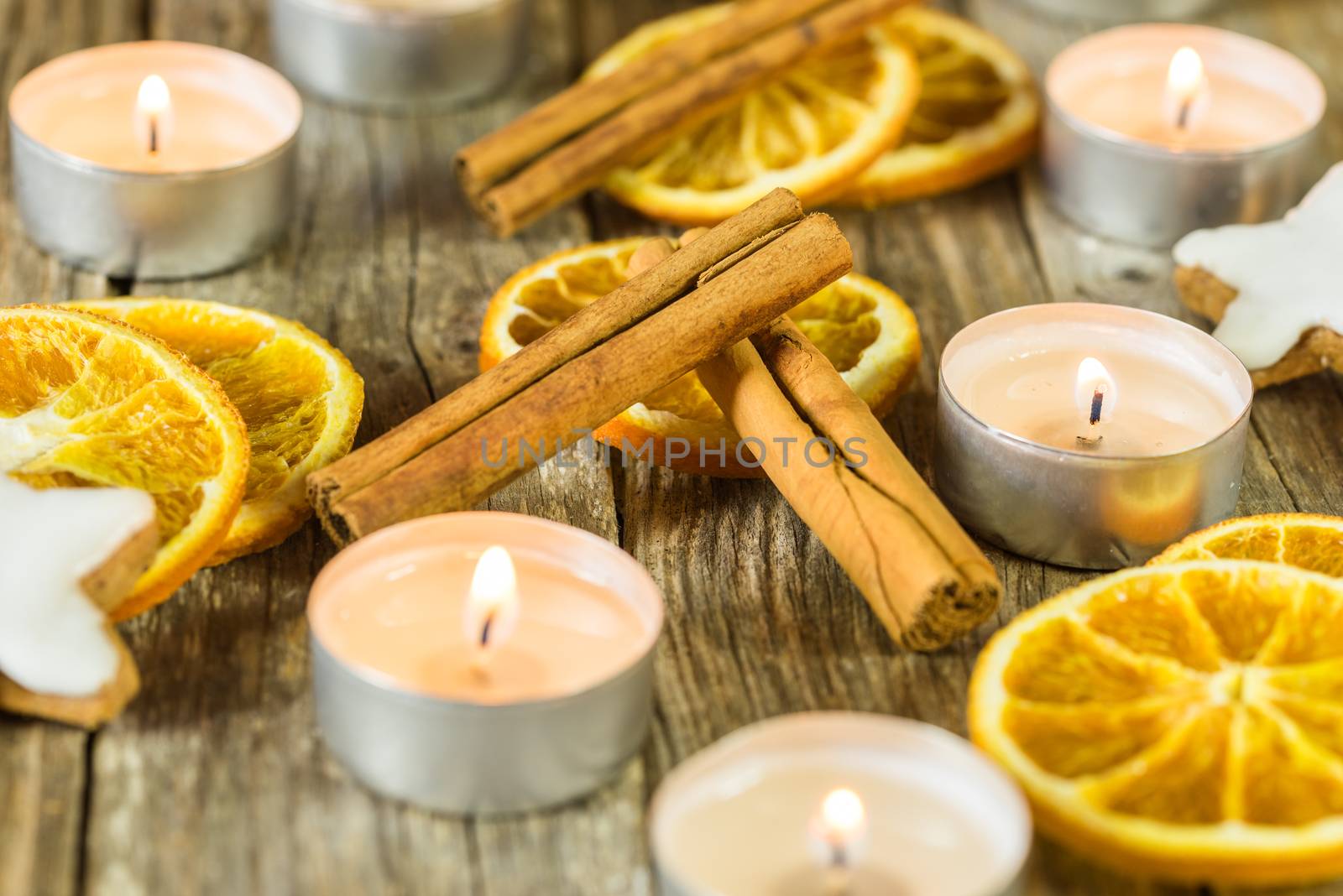 Burning Christmas and Advent candles with aromatic decoration