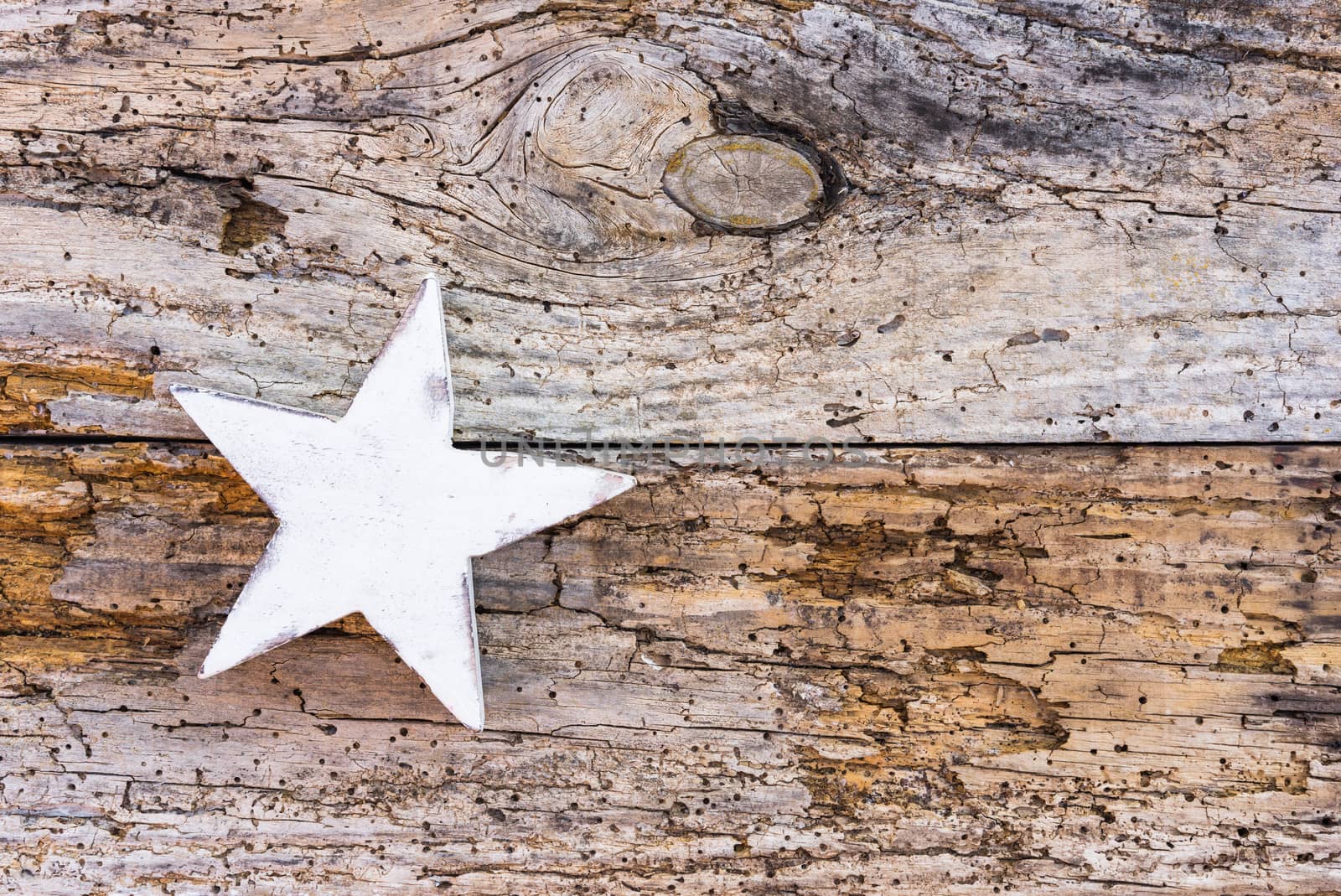 Christmas star decoration on old wooden background with copy space