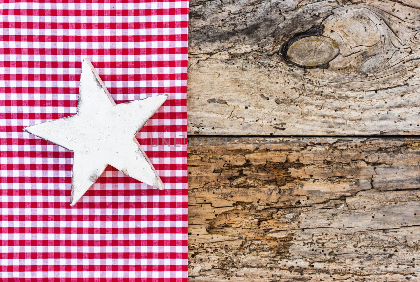 White Christmas star ornament on rustic background, copy space