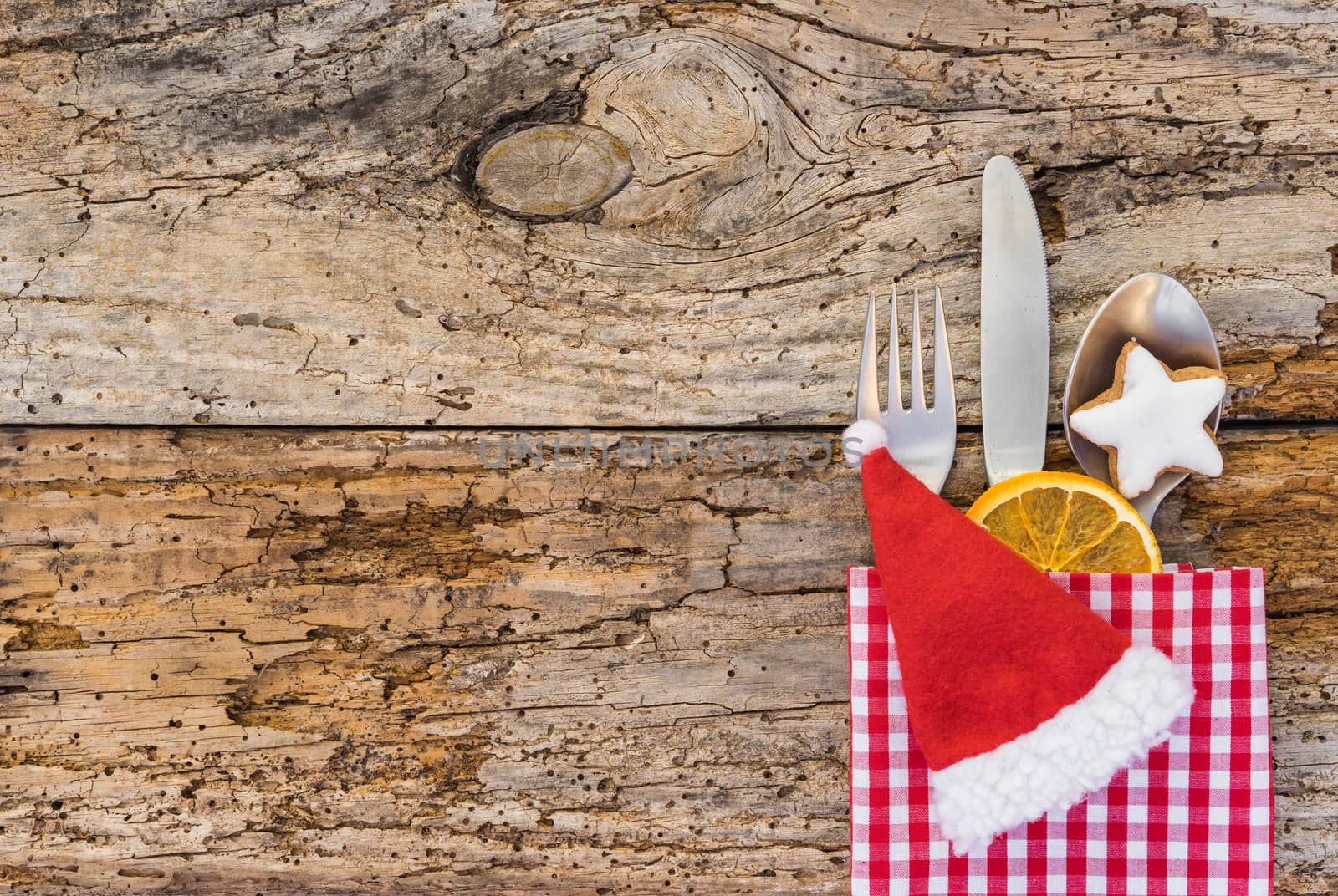 Christmas table setting for holiday dinner top view, empty space for text