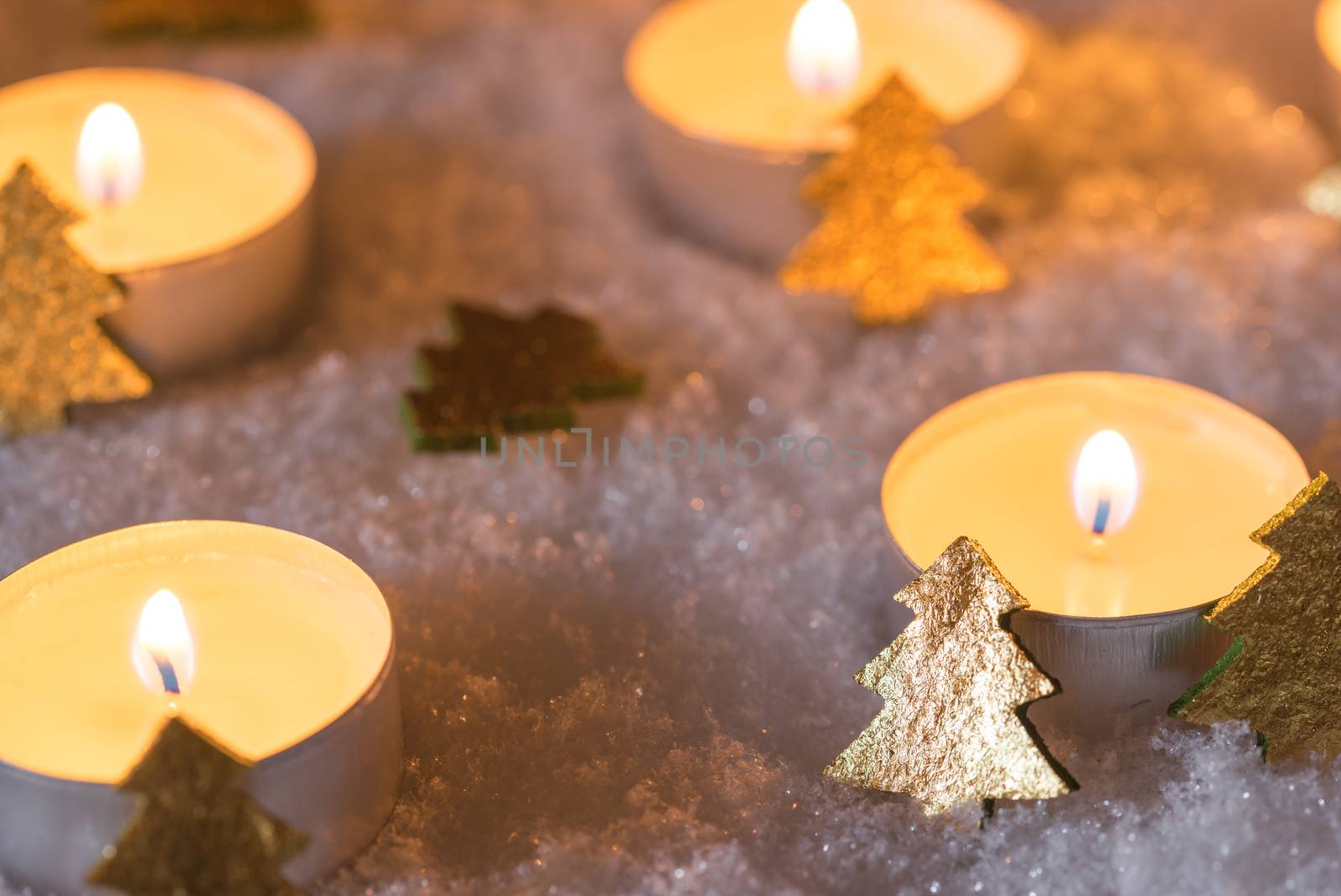 Christmas december night with candles decoration on snow by Vulcano