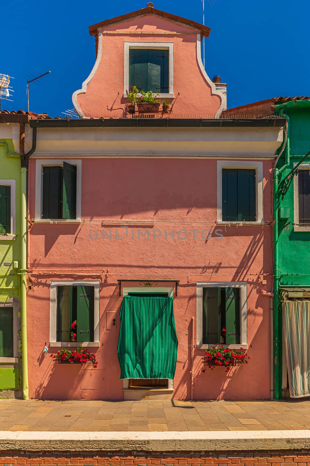 Pig skintone coloured house in Burano, Italy by COffe