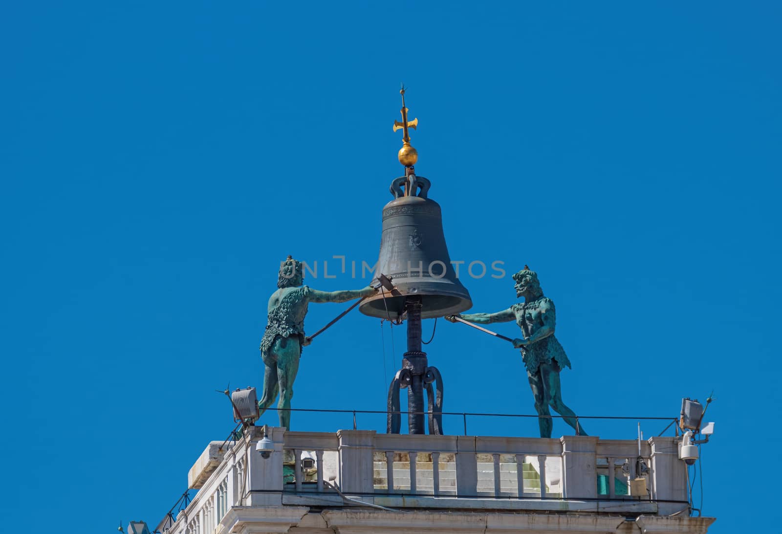 Old bronze bell at the top of St Mark's clocktower at piazza San Marco in Venice, Italy by COffe