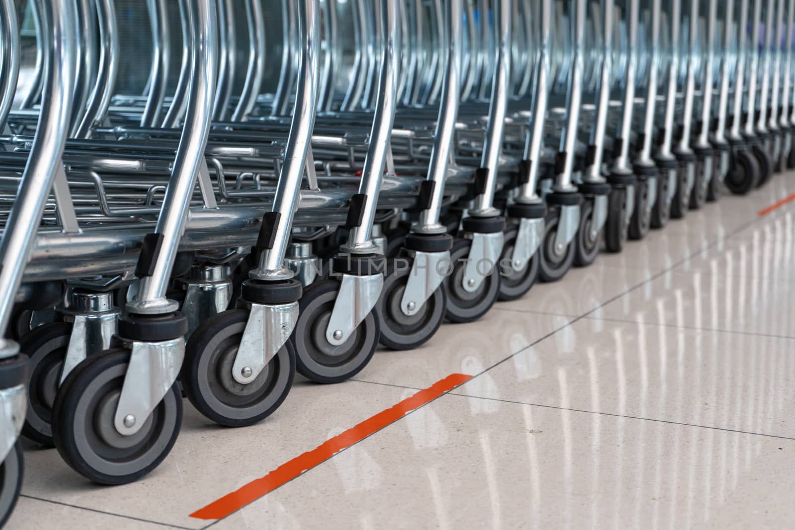 A row of carts in a supermarket. Carts for luggage