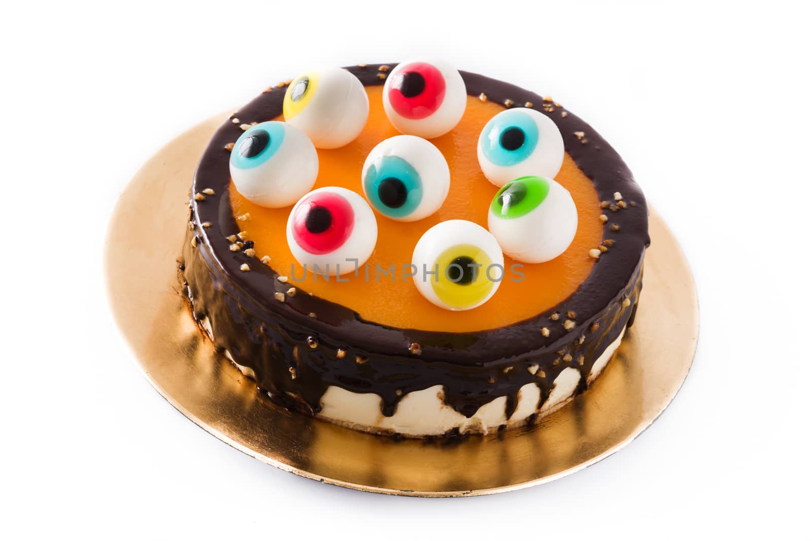 Halloween cake with candy eyes decoration isolated on white background.