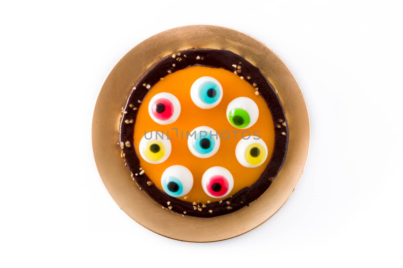 Halloween cake with candy eyes decoration isolated on white background. by chandlervid85