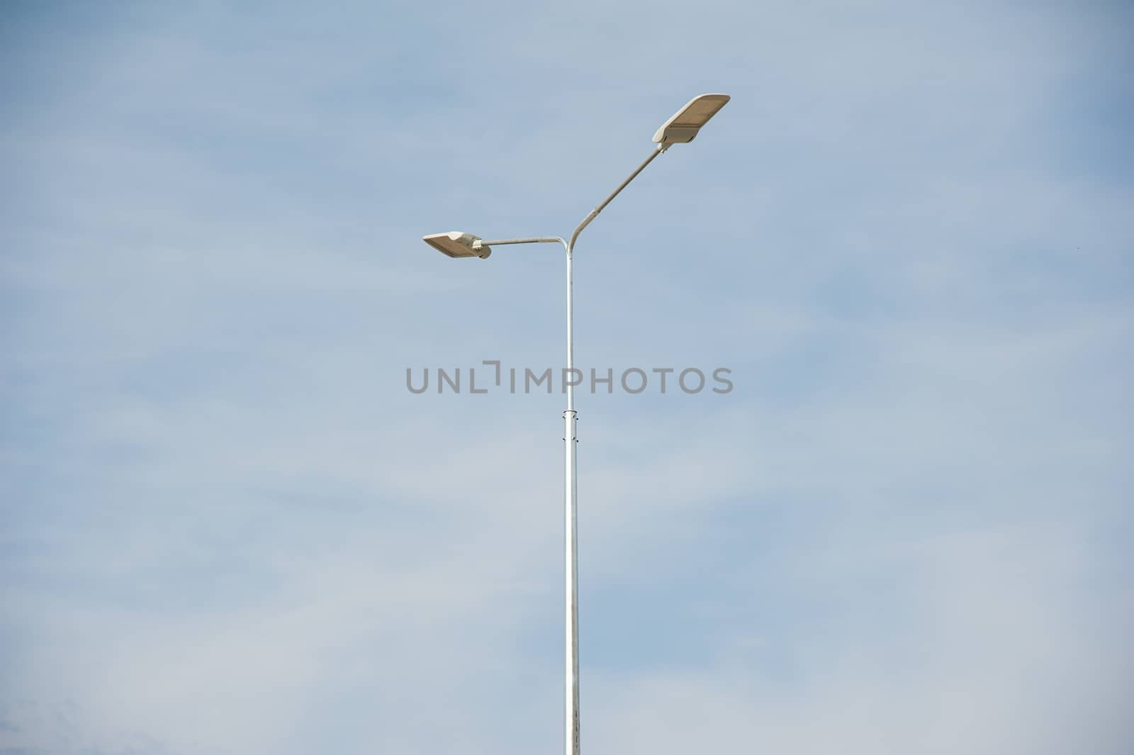 Street lamp with beautiful blue sky in background