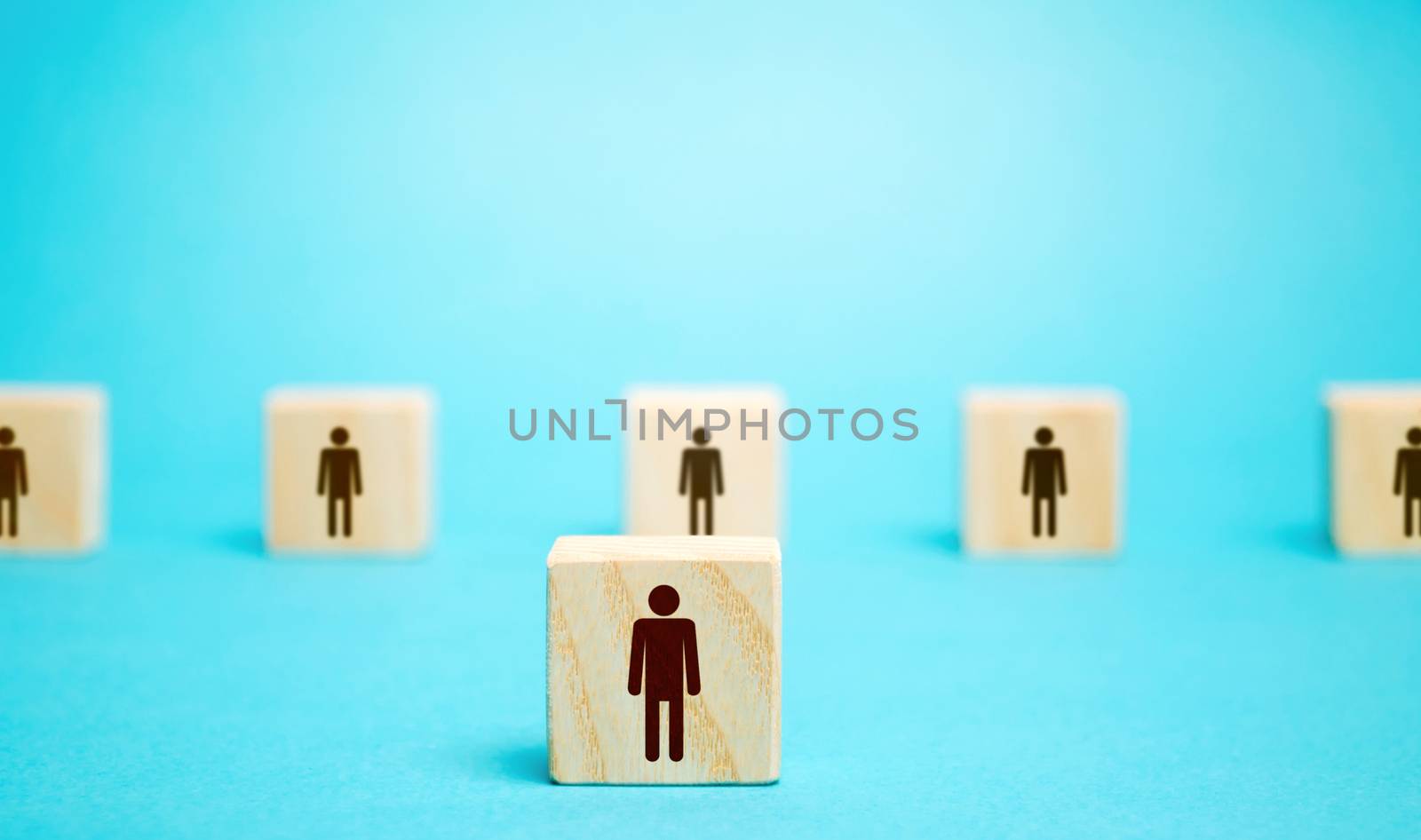 A block man stands out from a row number of people. Leader, leadership skills. Filling of vacancies with professional specialists. Staffing. Talented employee. Concept of individuality and personality