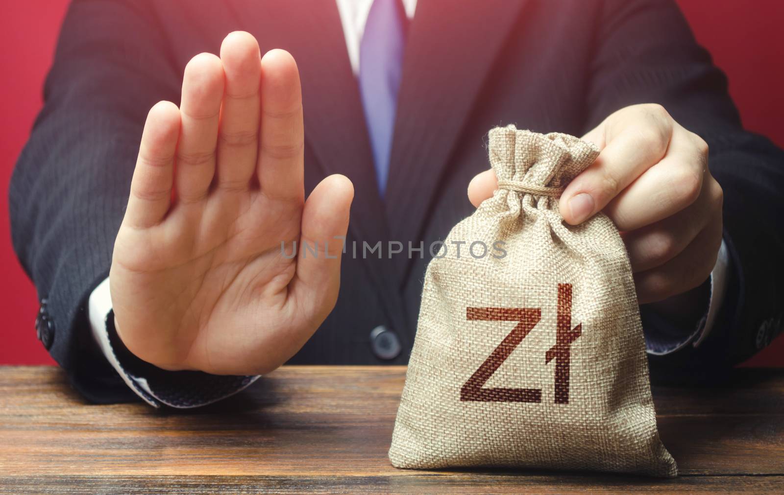 Businessman refuses to give polish zloty money bag. Loan refusal, bad credit history. Asset freeze. Stop financing projects and reforms, crisis financial difficulties. Payment refund. Deception, fraud