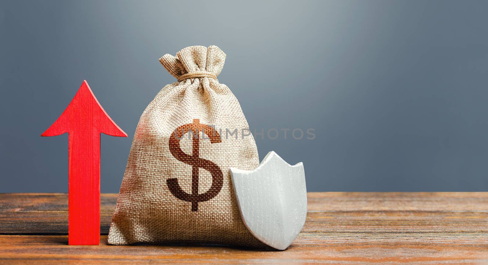 Dollar money bag with a shield and a red arrow up. Increasing the maximum amount of guaranteed insurance compensation for deposits. Safety security of investments, savings, financial system stability
