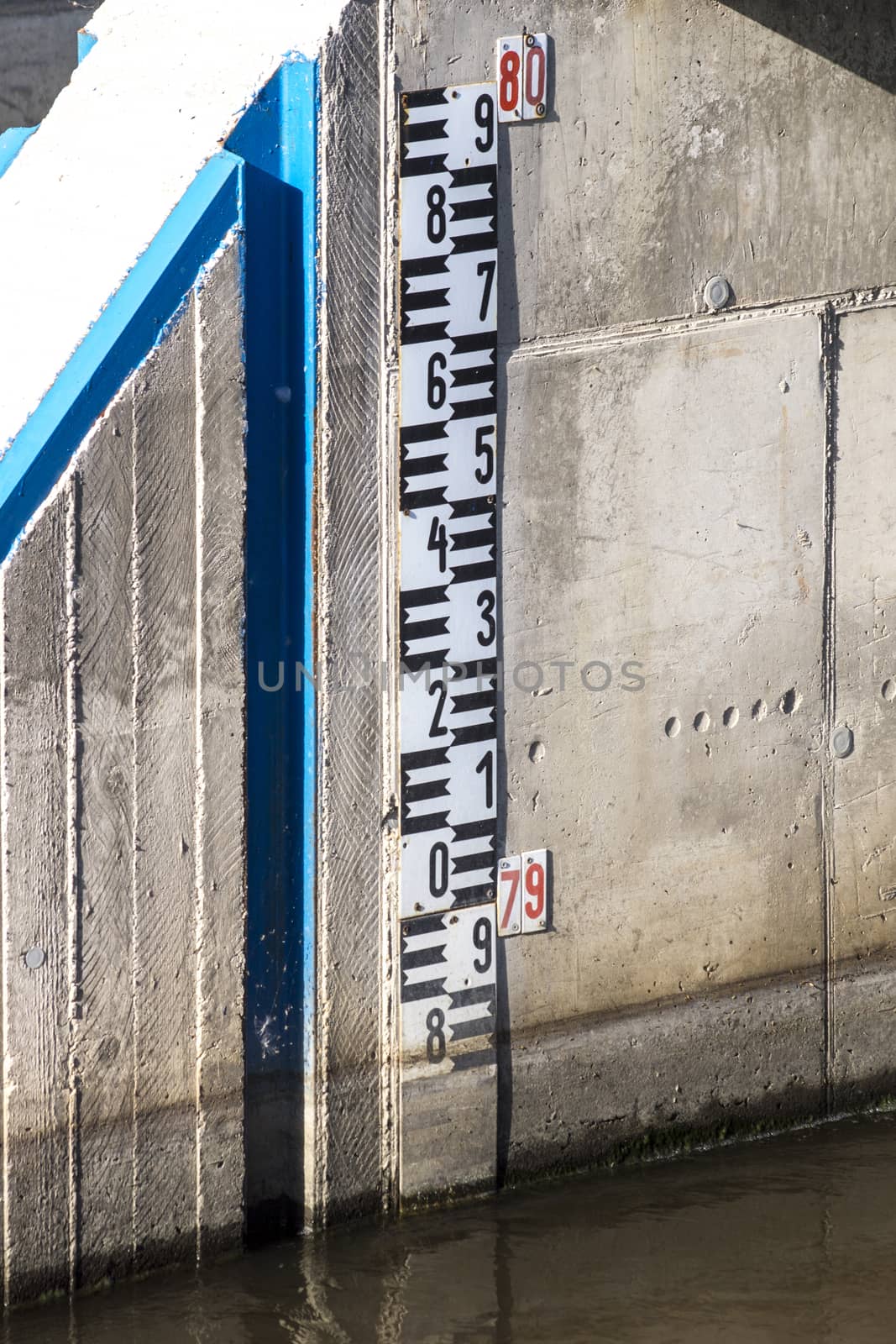 The railing and sluice regulate the water.