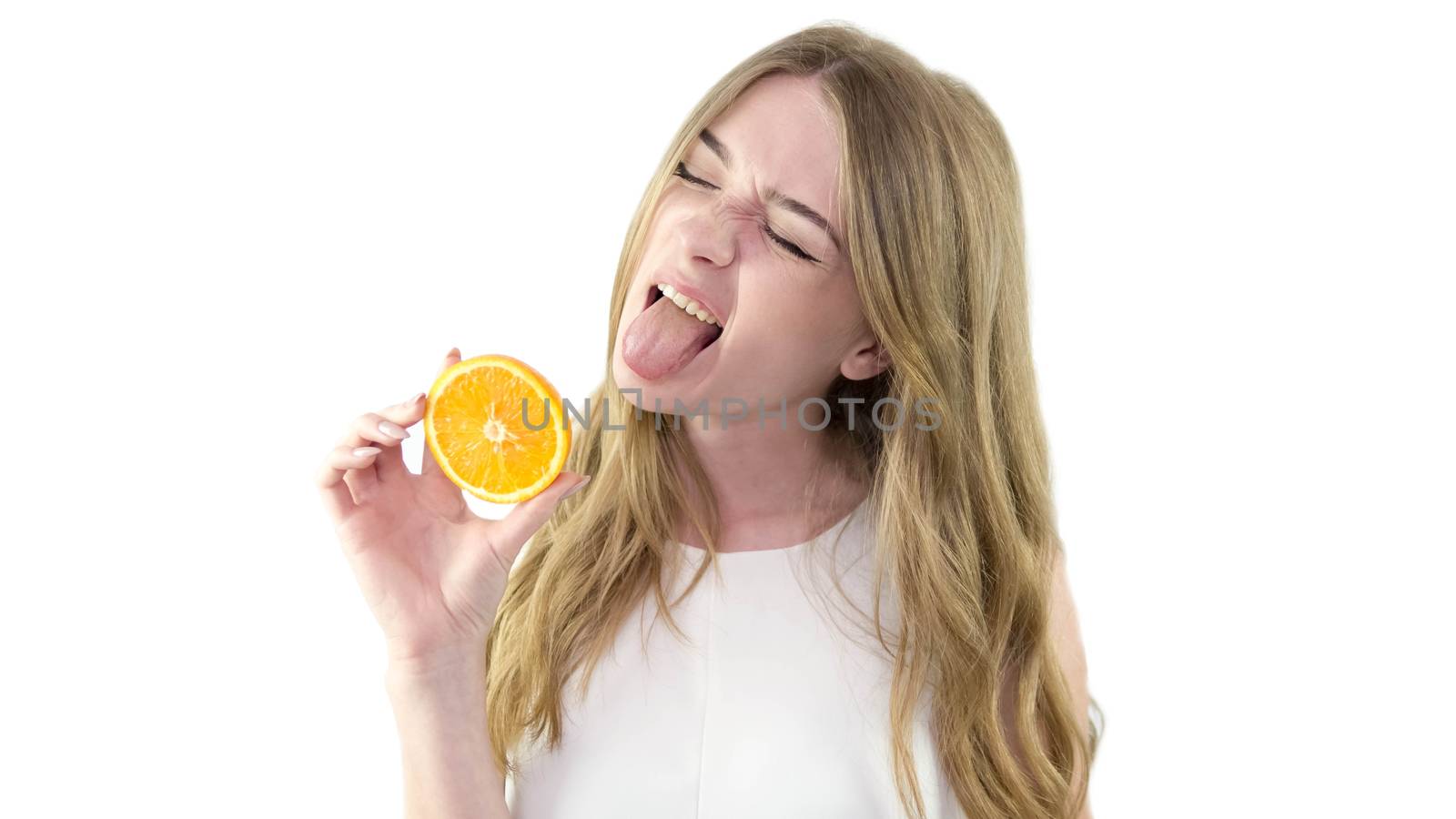 Girl with an orange in hand,a beautiful little girl in a white dress,on a white background,portrait,close-up.