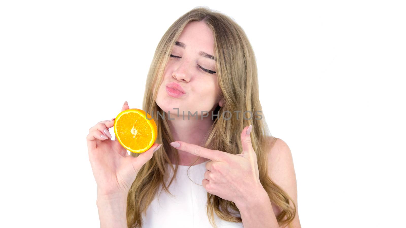 Girl with juicy fruit,on a white background,close-up,beautiful and young girl in a white dress with an orange in her hand.