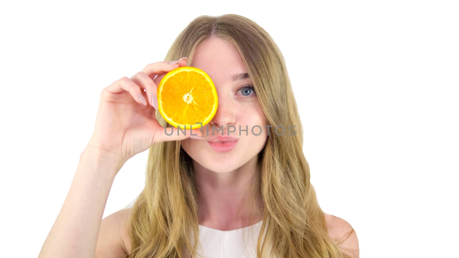 Portrait of a charming,cute girl,woman on a white background,with fruit in her hand. Close-up.