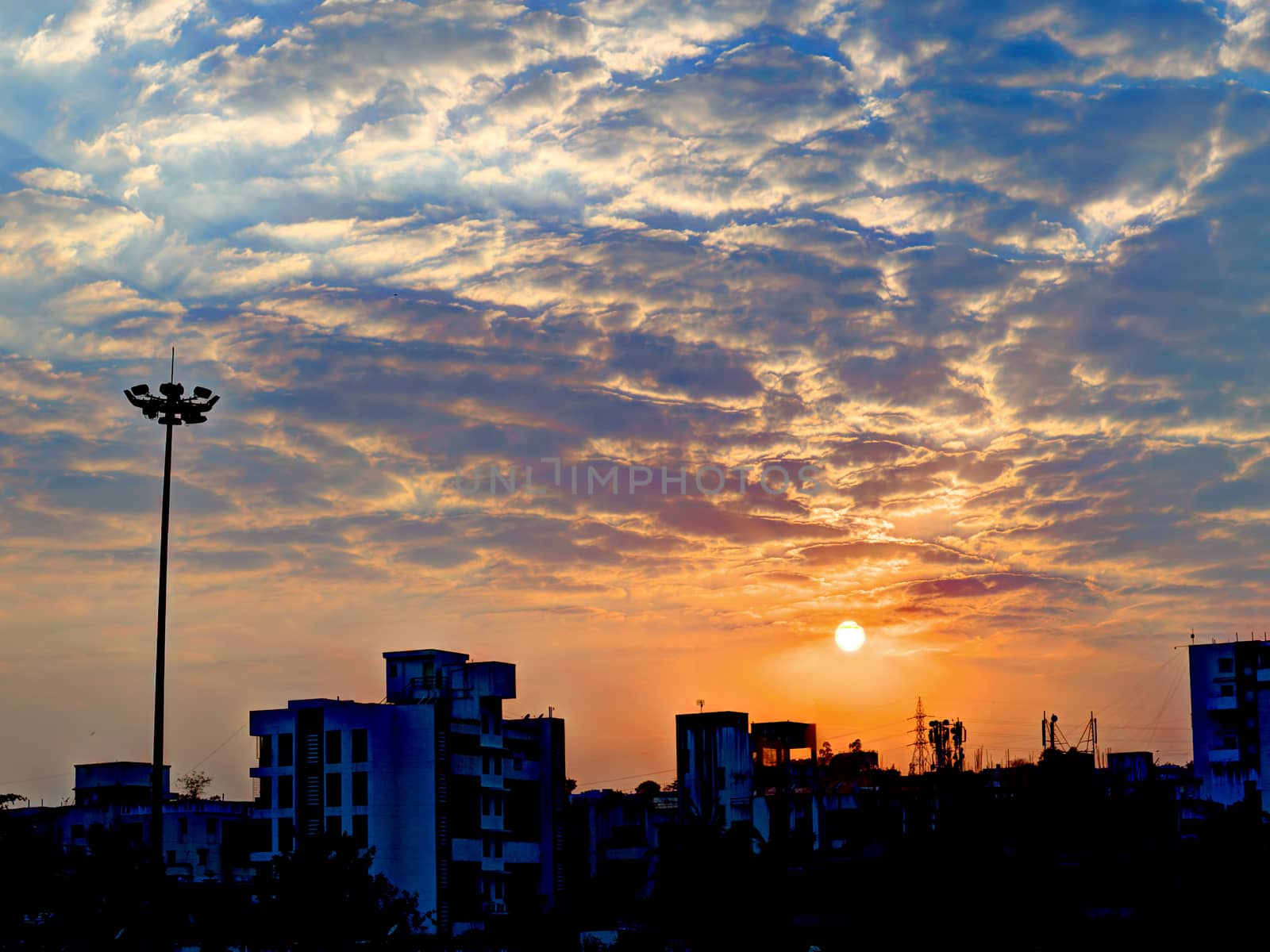 Beautiful Sunset with high-mast lamp in Warje, Maharashtra. by lalam