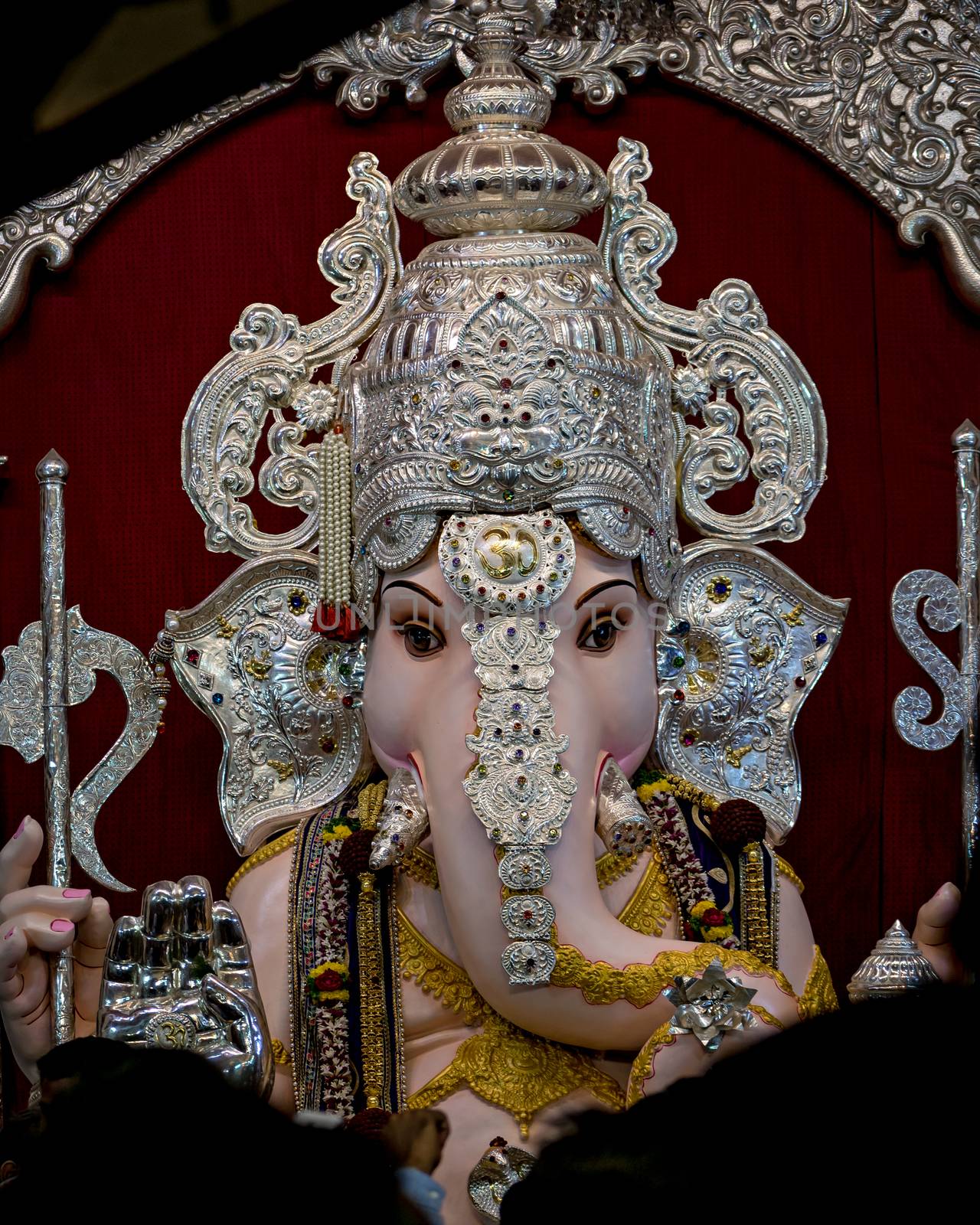 Close up portrait view of decorated and garlanded  idol of Hindu God Ganesha in ulshibaugPune ,Maharashtra, India.