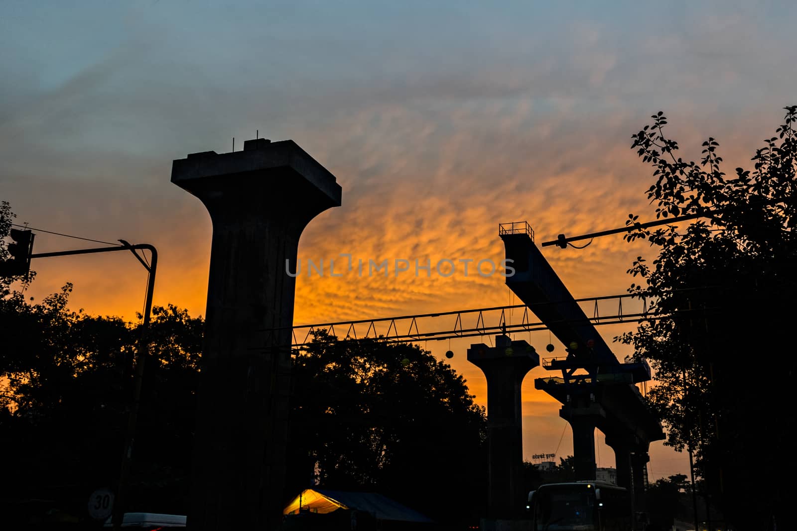Pune metro railway work in progress on the backdrop of beautiful morning sky. by lalam