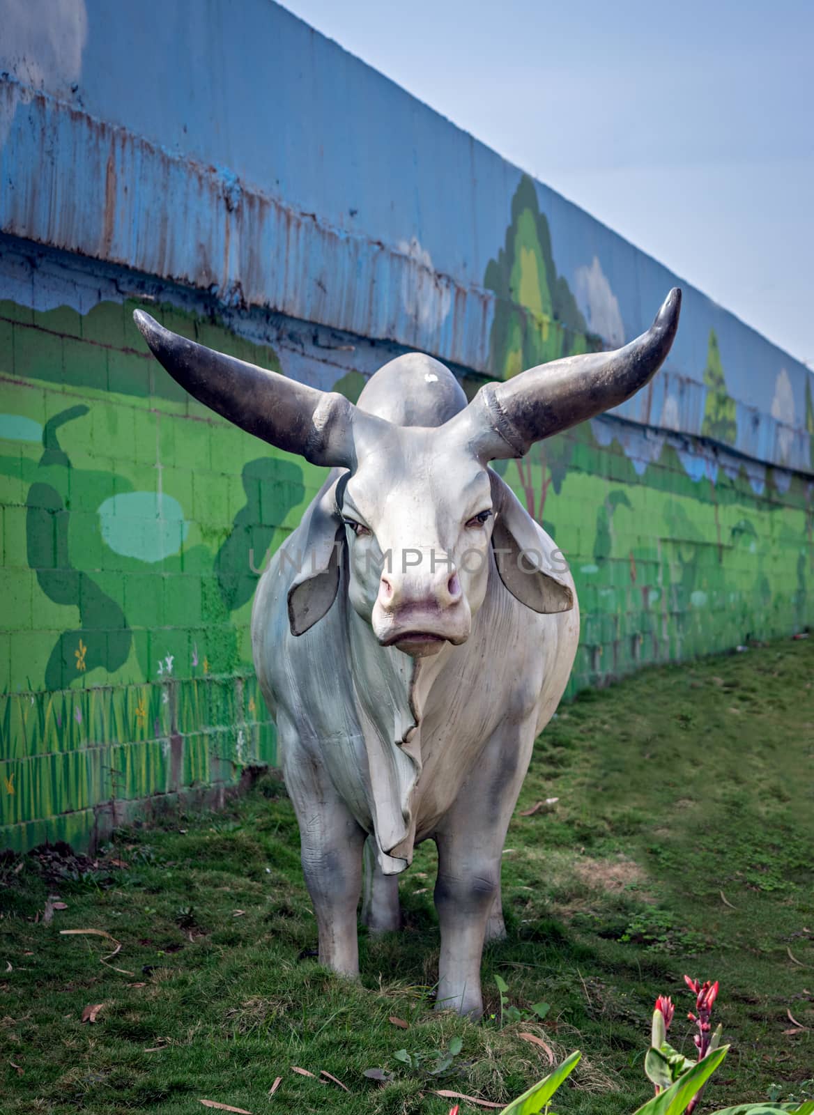 Life size, realistic sculpture of a charging bull in Warje. by lalam