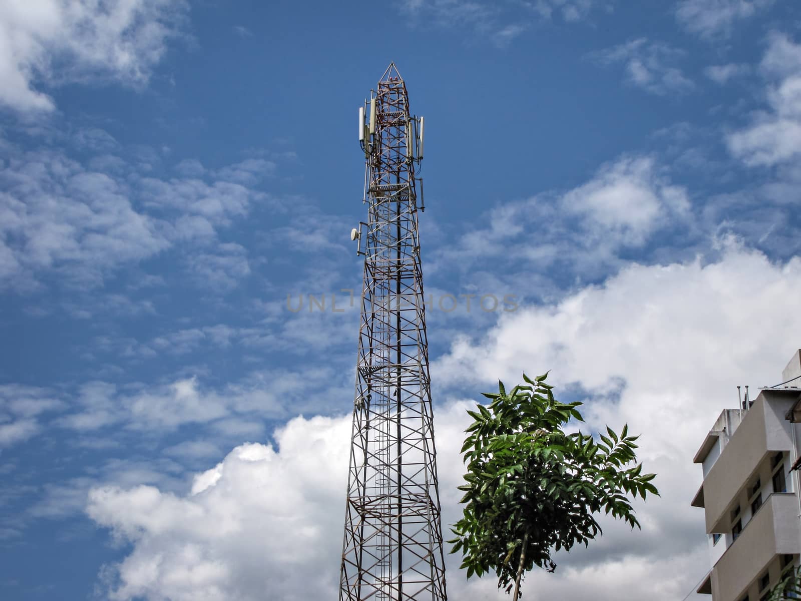 An isolated photo of cell phonemobile tower on background of nice blue sky. by lalam