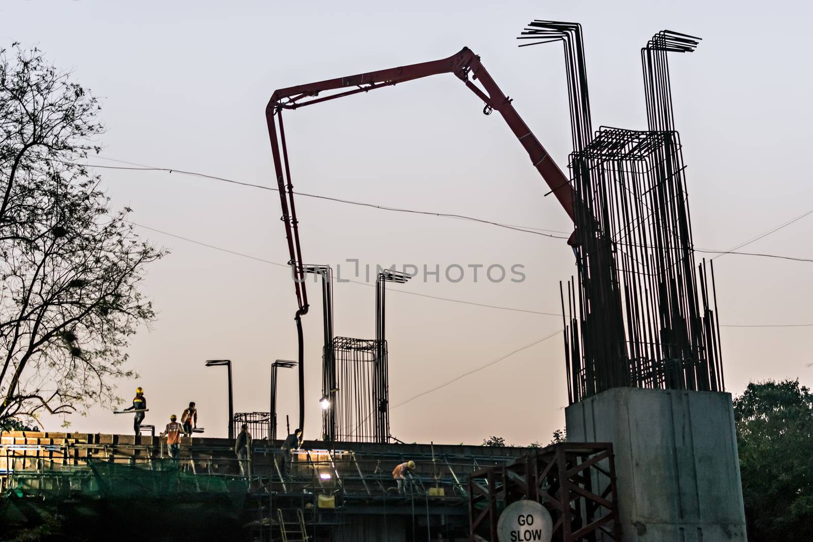 Pune metro train project work in rapid progress on the backdrop of beautiful early morning sky. by lalam