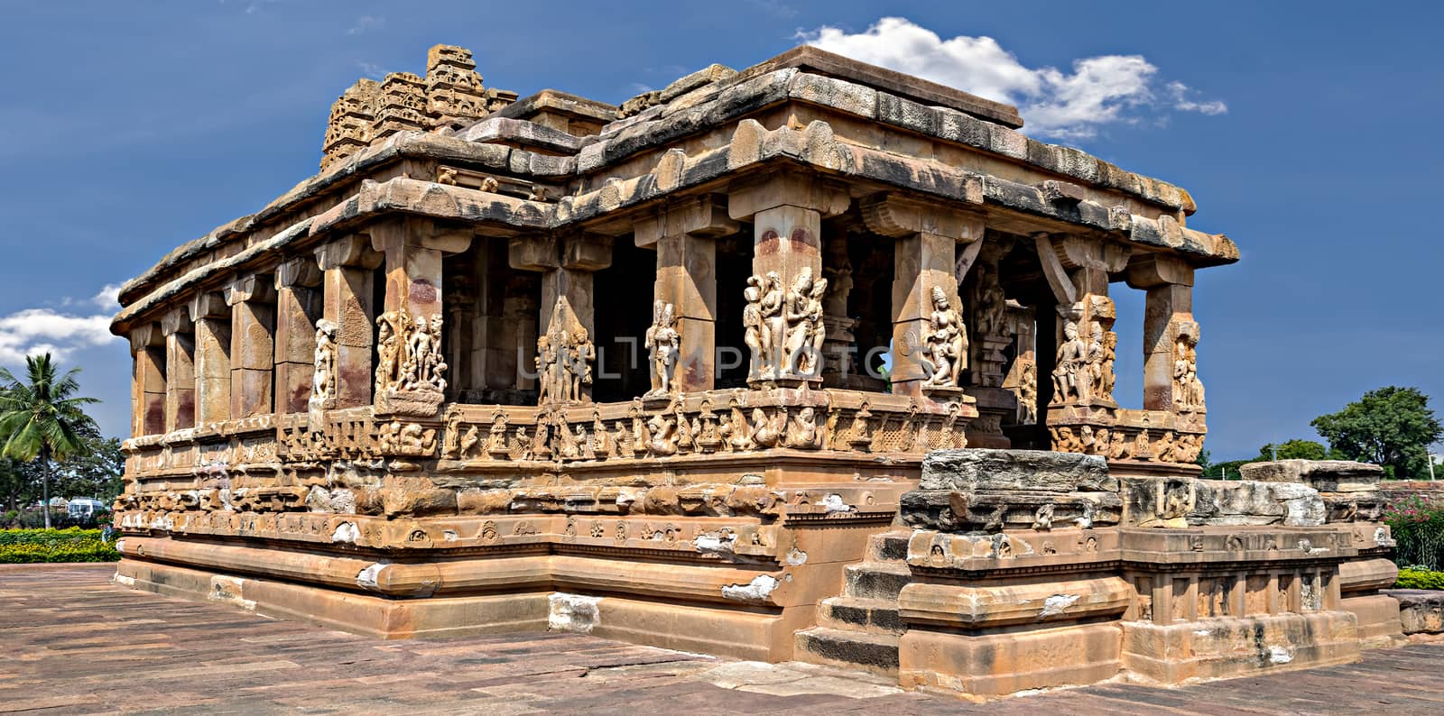 Entrance of Durga temple with blue sky and clouds, Aihole, Bagalkot, Karnataka, India. by lalam