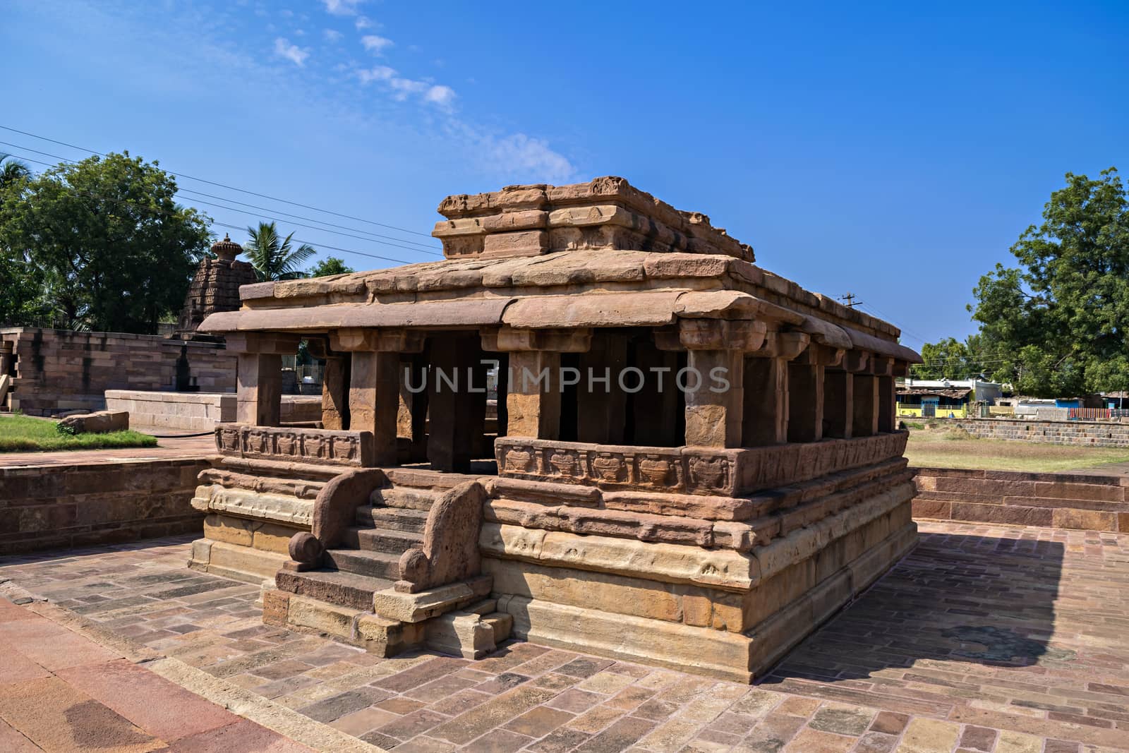 Ancient 8th century carved stone temple with beautiful blue sky at Aihole, Karnataka, India. The exquisite sculpted monument has been excavated. by lalam