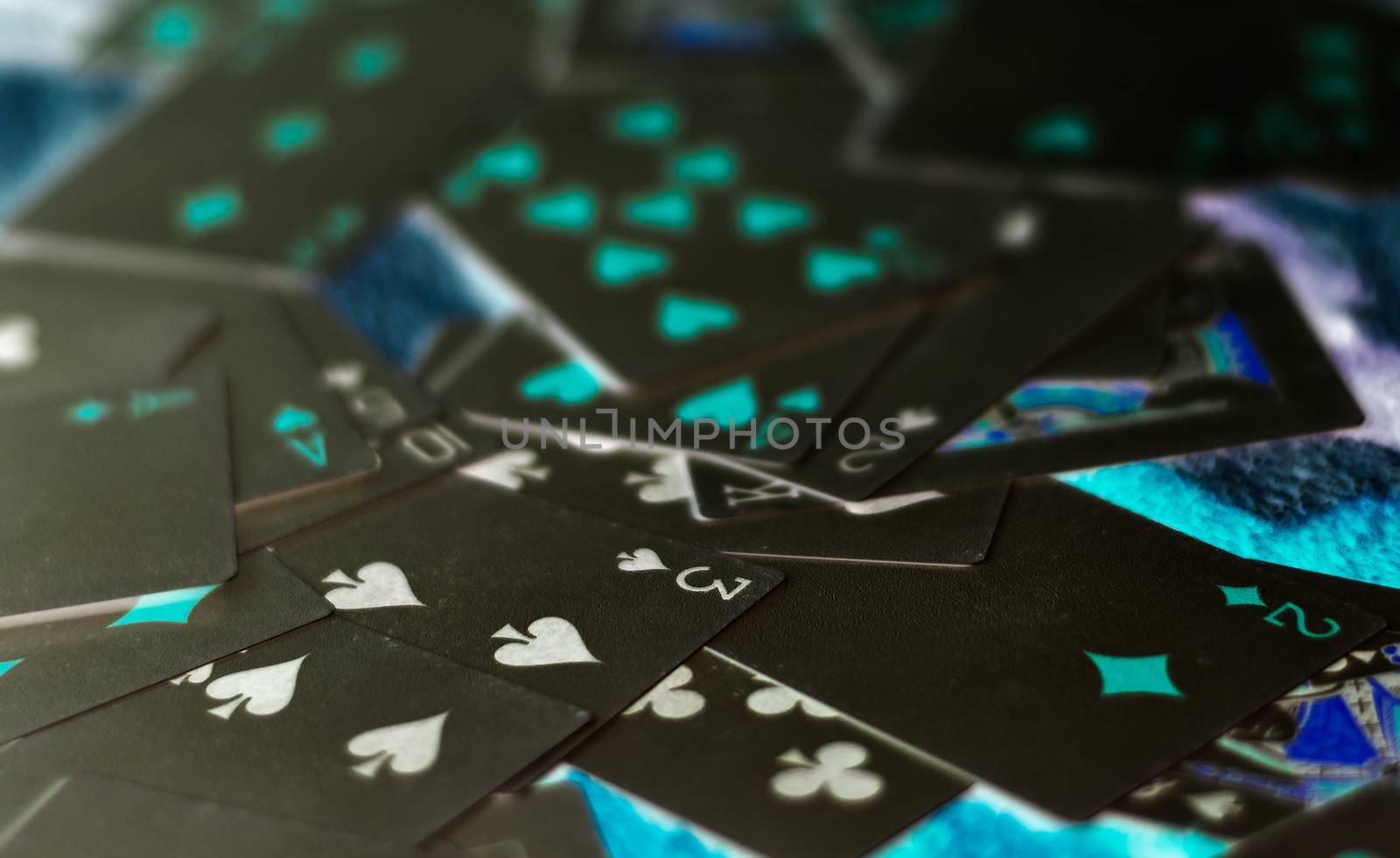 Marble poker cards spread out and mixed face up by rkbalaji