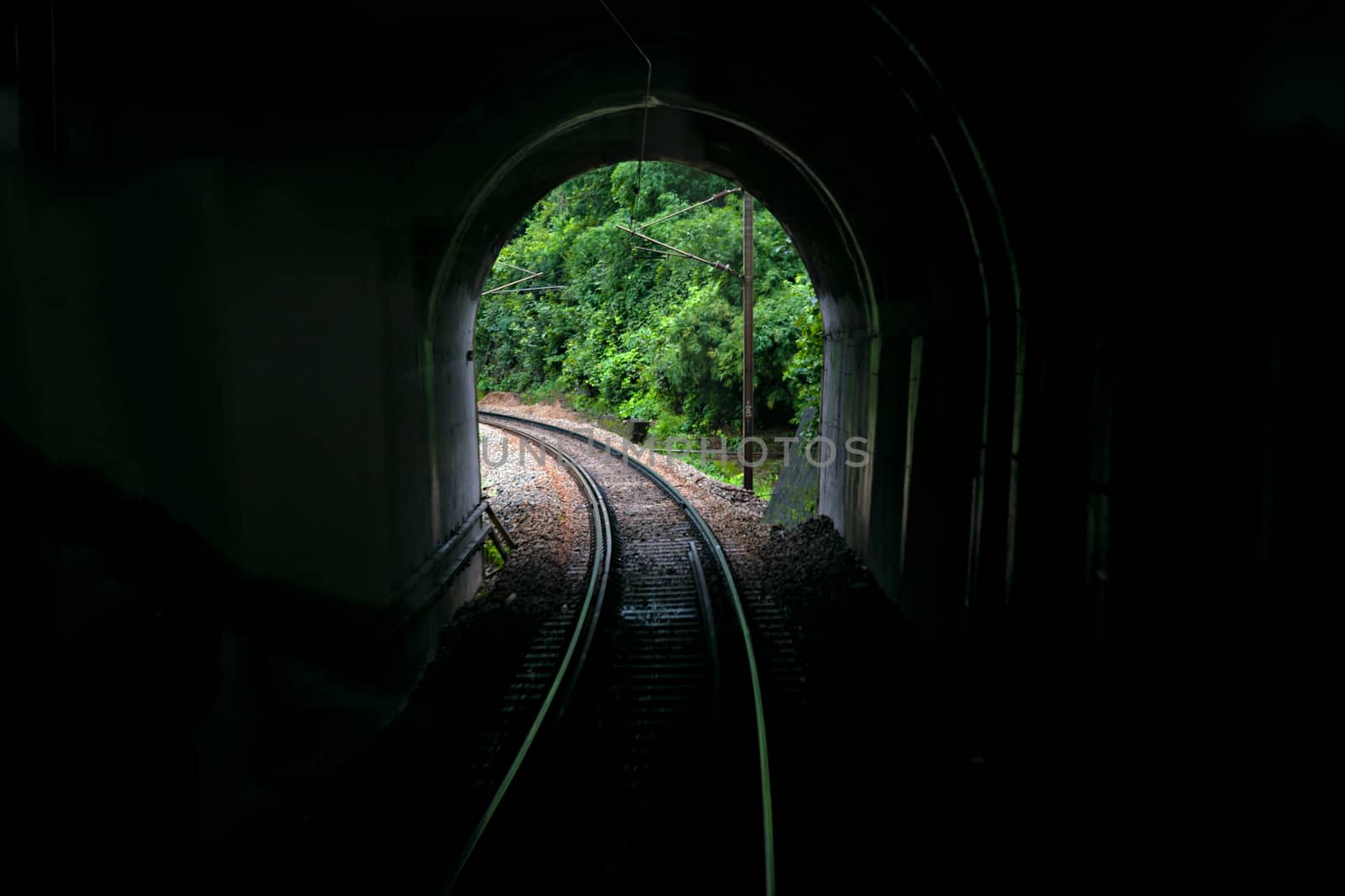 Image taken from vistadome tourist coach of a tunnel portal with railway line.