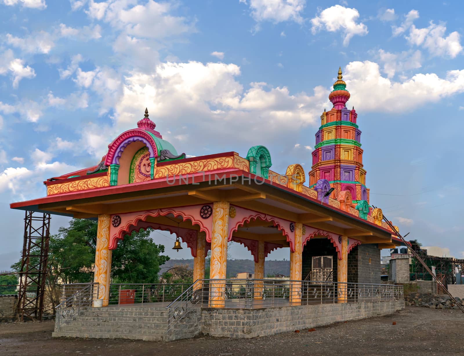 Colorful temple with nice cloudscape in Bavdhan village of Pune, Maharashtra, India. by lalam