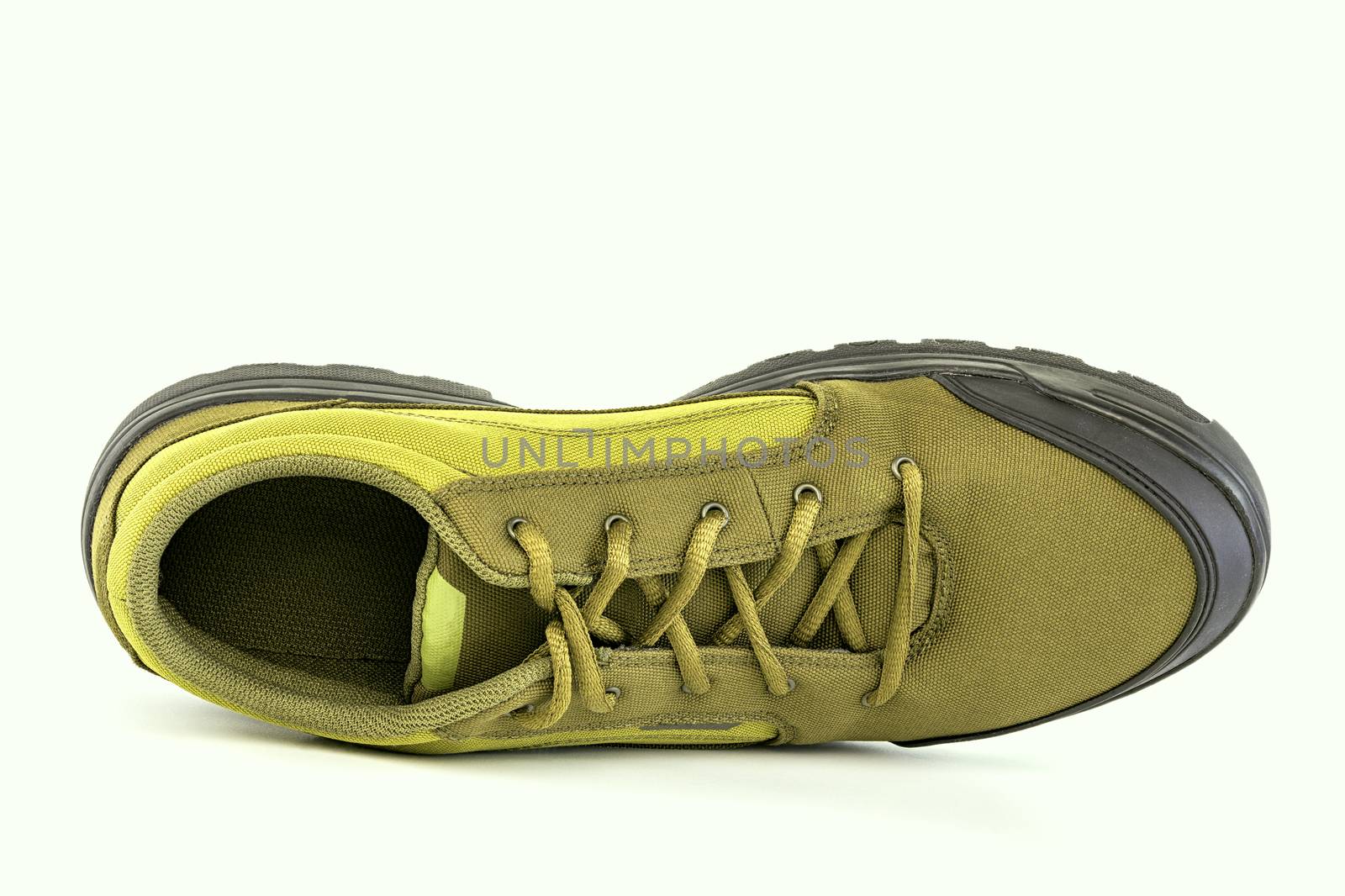 one right cheap yellow fabric hiking shoe isolated on white background.