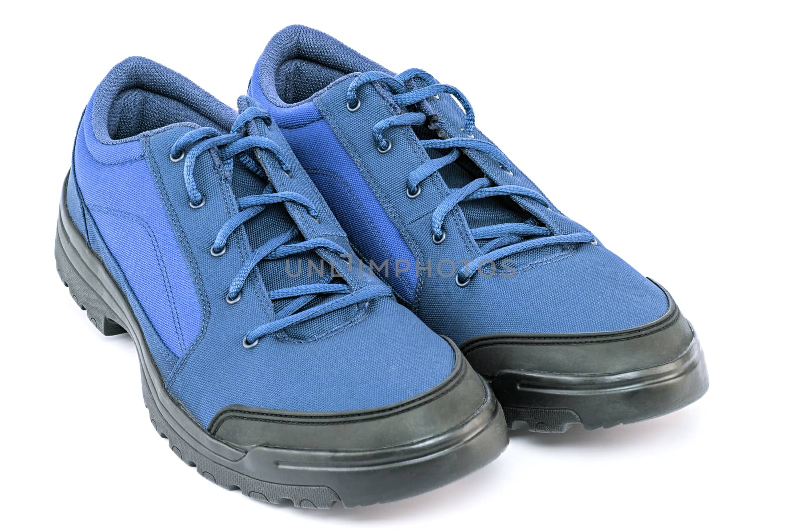 a pair of blue cheap durable fabric travel shoes isolated on white background.